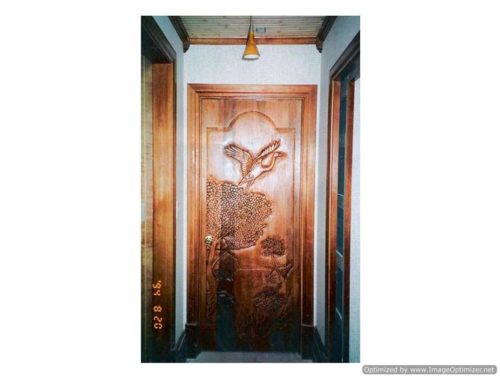 rustic carved wood door for cabin or lodge