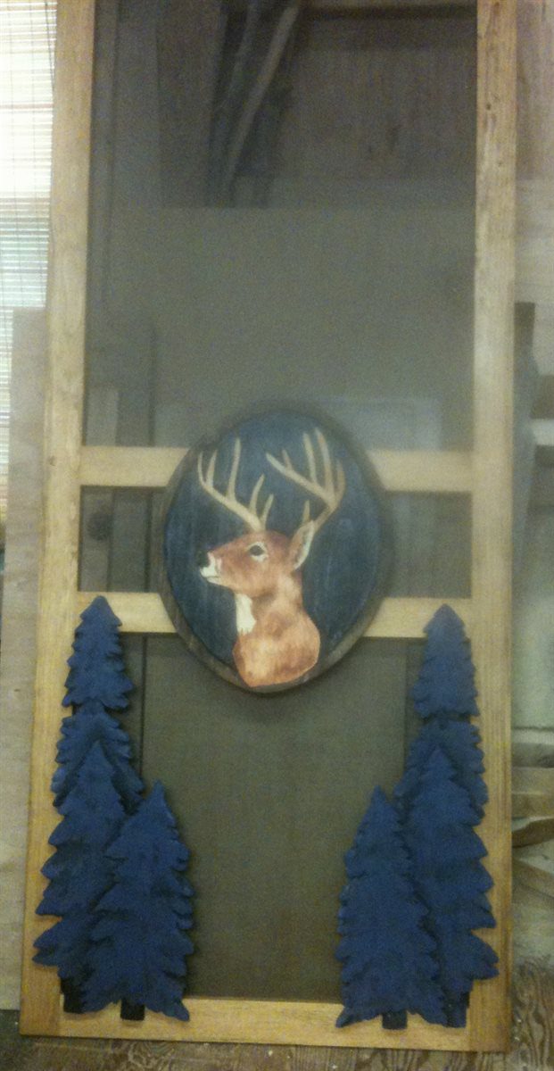 screen door with carved deer