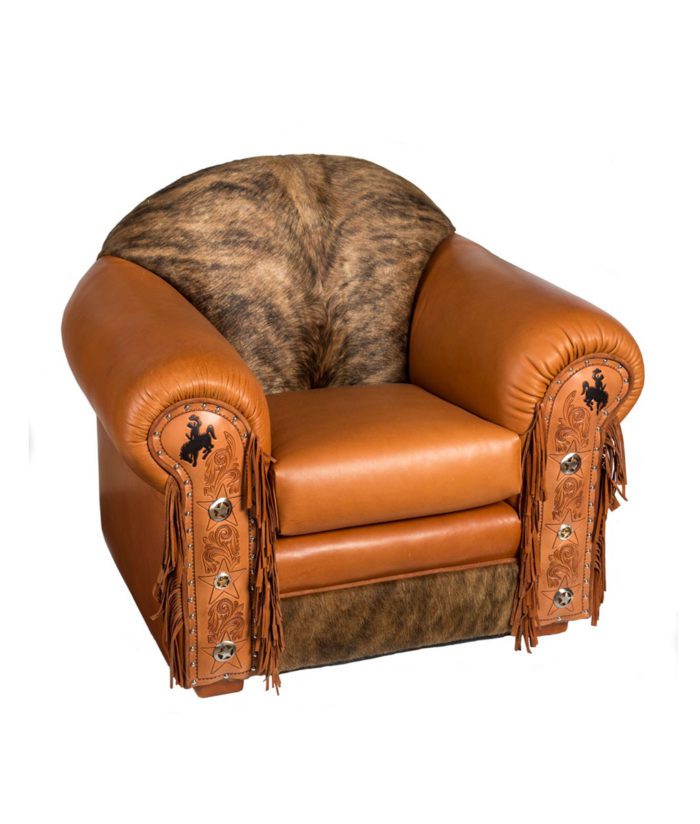 Cowhide and leather armchair with tooled leather, fringe and conchos, Fully customizable | Western furniture and decor from RusticArtistry.com