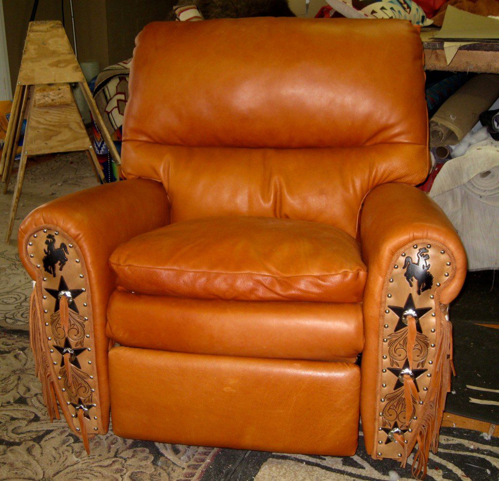 Western style recliner chair with tooling, fringe and conchos