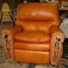 Western style recliner chair with tooling, fringe and conchos