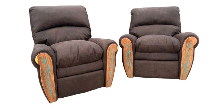 pair of brown leather recliners with turquoise inlay arm panels