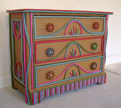 Painted Adirondack style dresser with colorful willow twigs