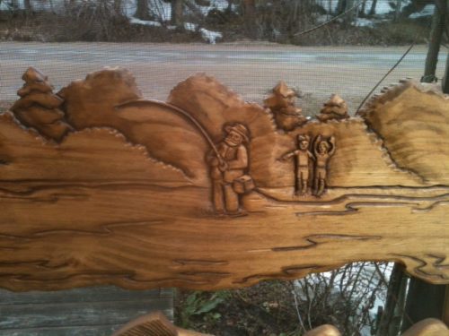 close up of fisherman and grandchildren on carved wood screen door