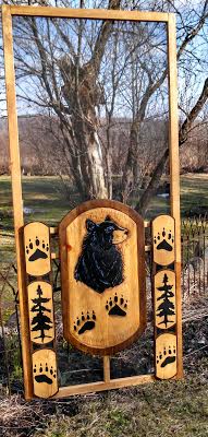 wood screen door with bear and paw prints center panel and 3 section side panels