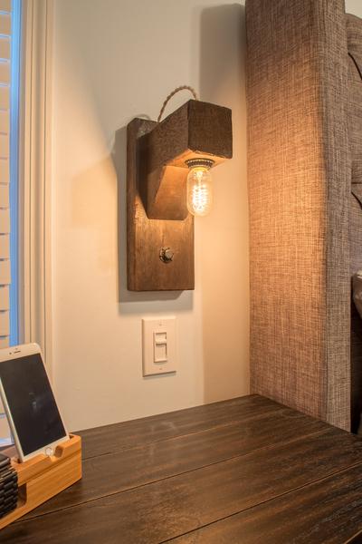 Mounted wood beam wall sconce