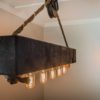 Rustic wood beam chandelier with rope and pully