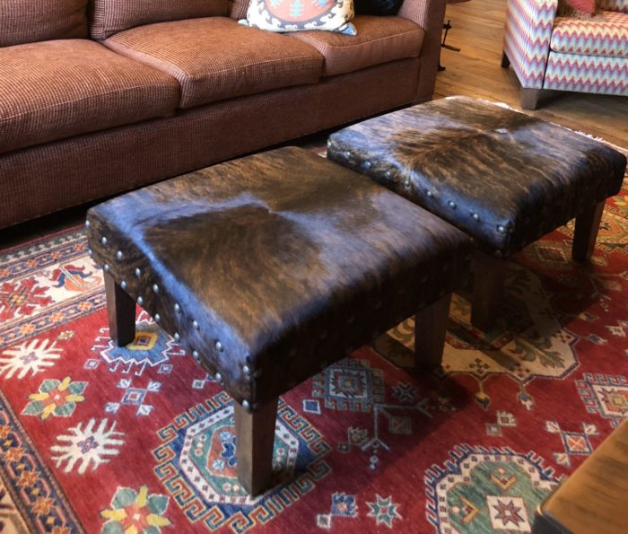 pair of square cowhide ottomans in. home