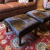 pair of square cowhide ottomans in. home