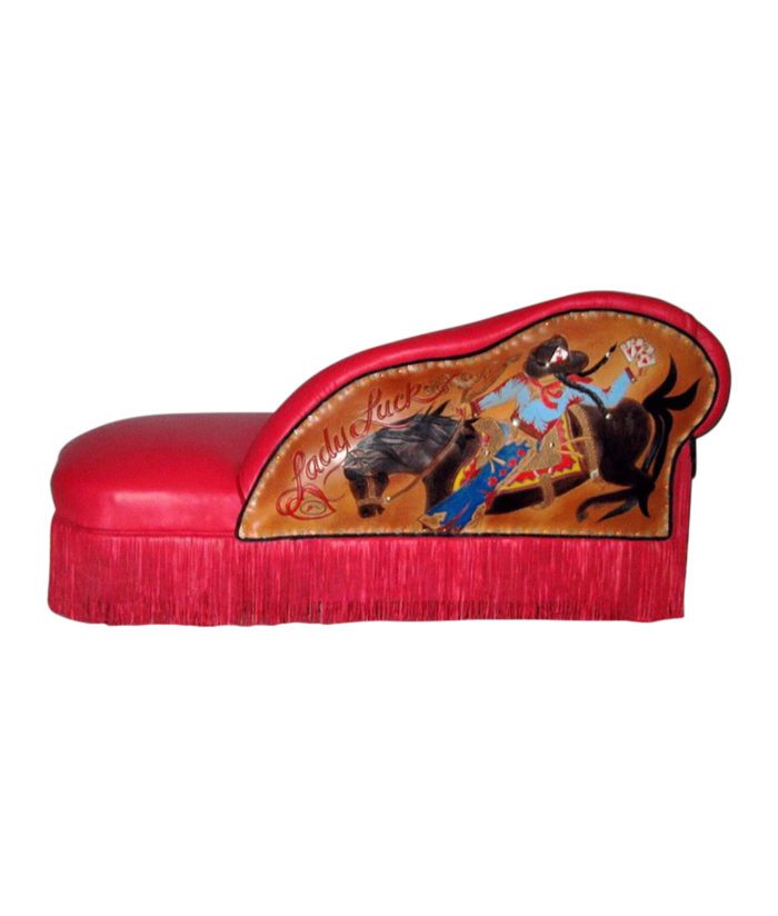 red chaise lounge with rodeo woman in tooled leather