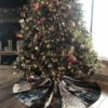 cowhide Christmas tree skirt under tree