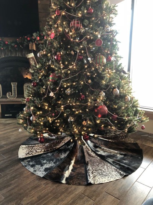 cowhide Christmas tree skirt under tree