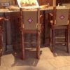 Western style bar stools with natural branch arms