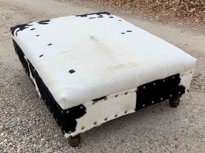 cowhide ottoman in black and white cowhide