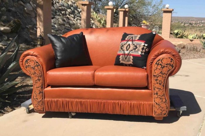 loveseat with tooled arms and gathered kick plate
