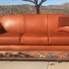 leather sofa with buffalos and horseback riders tooling