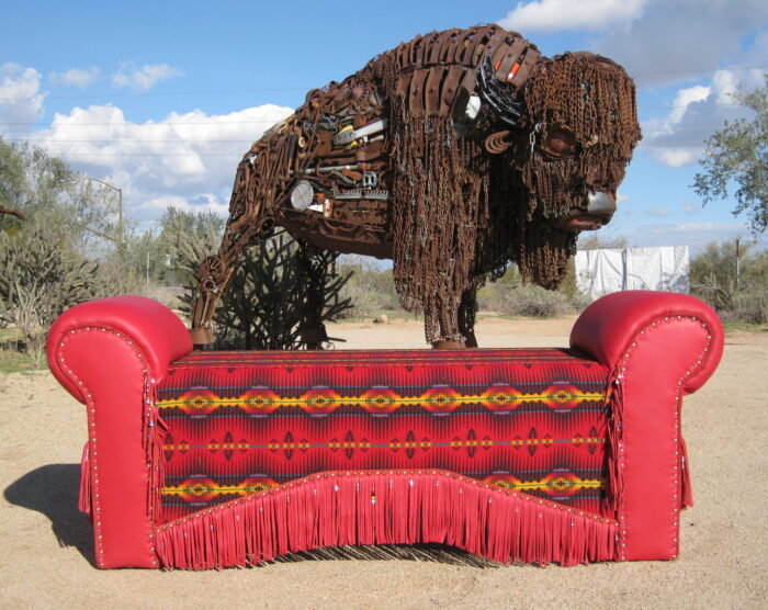 red bench with red black yellow Pendleton and fringe